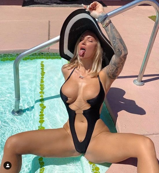 Viking.barbie, best Instagram model, wears skimpy swimsuit by the pool and shows her huge tits.